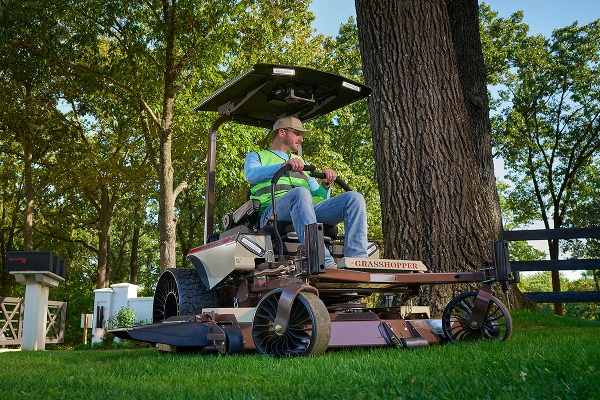 440 EFI MidMount Mower mowing green grass with mower shade cover