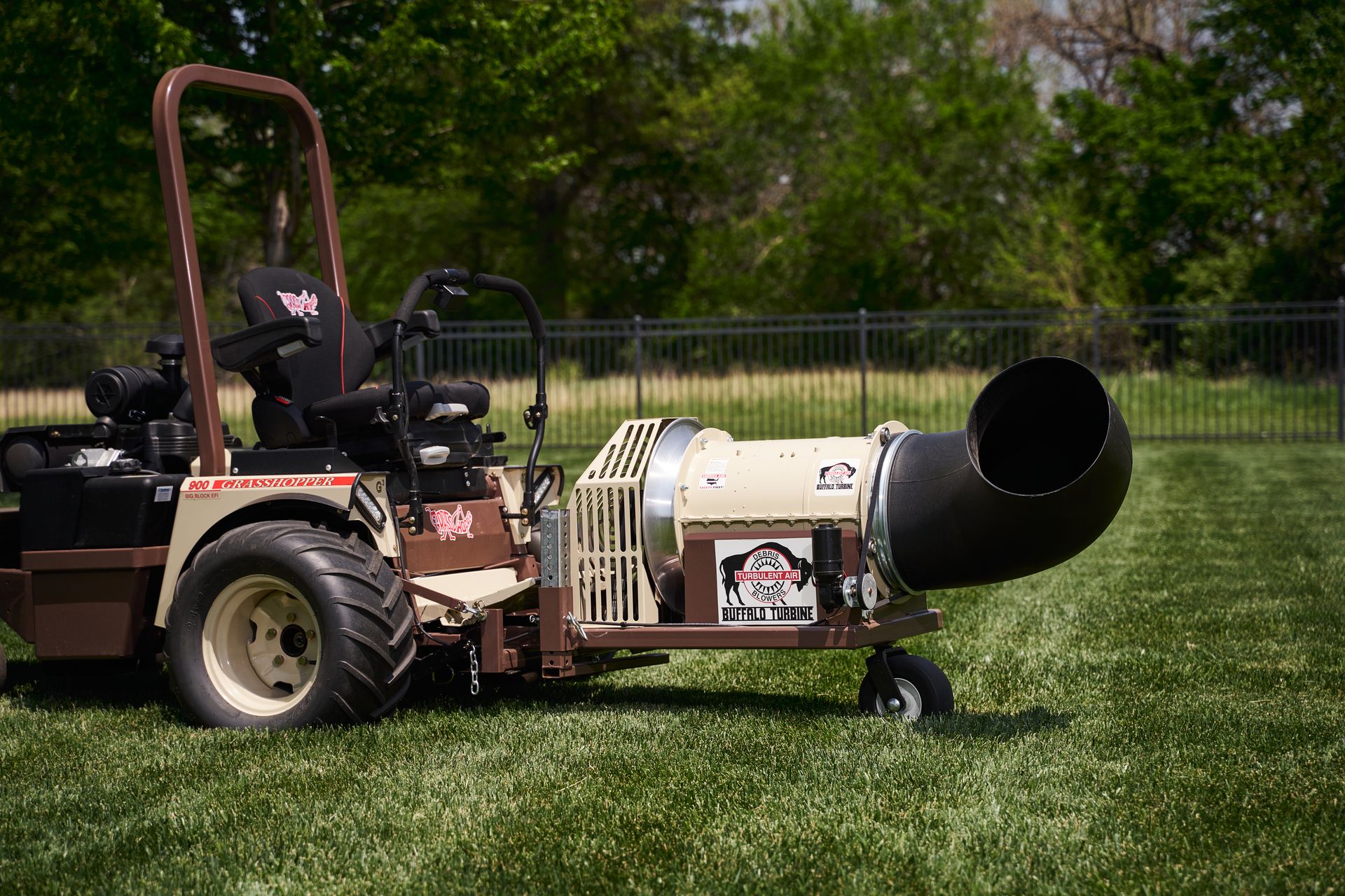 Grasshopper 900 mower fitted with a Buffalo Turbine debris blower attachment on mown turf.