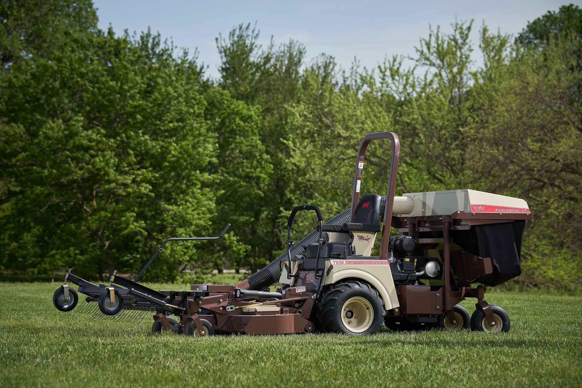 Grasshopper 725K FrontMount mower fitted with a tine-rake dethatcher and PowerVac HT collection system.