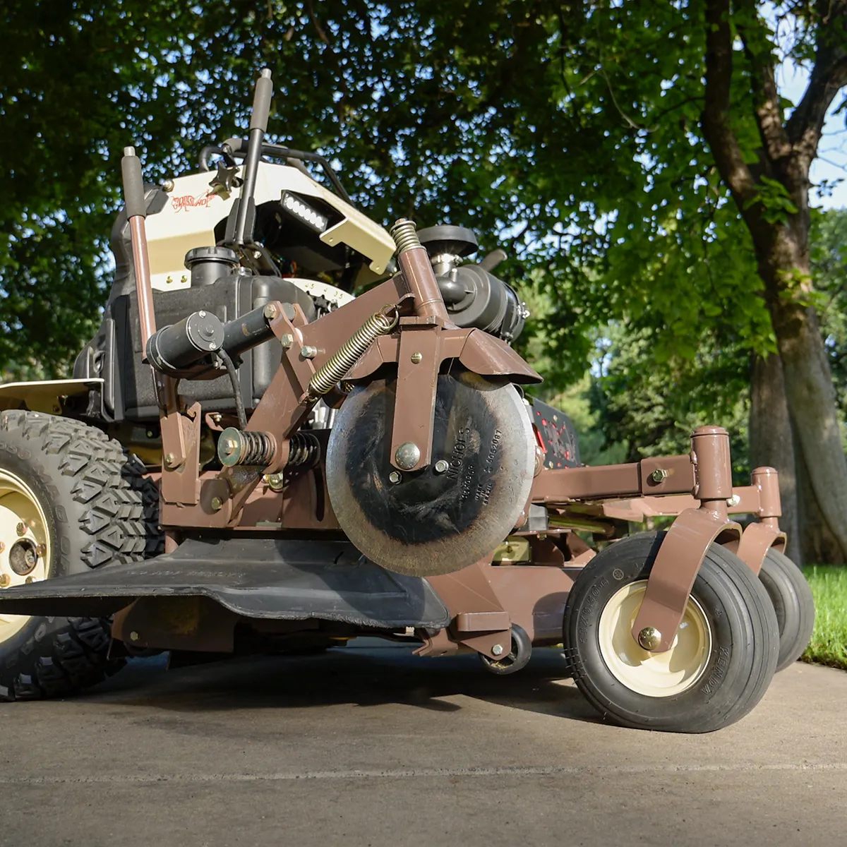 Stand-On Zero-turn mower edger attachment for commercial lawn mowers