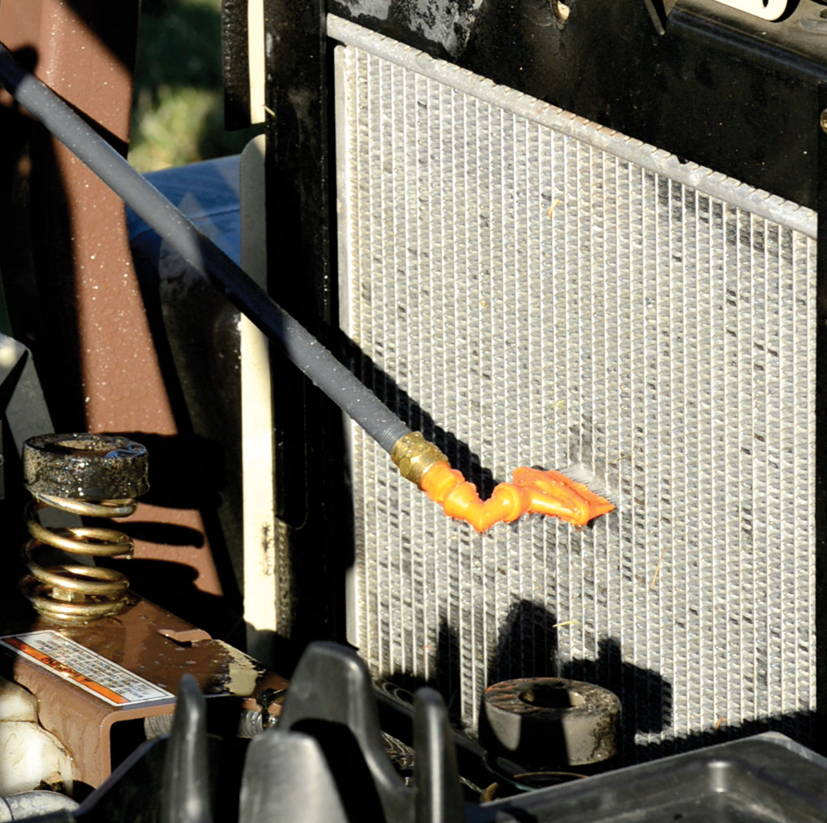 Radiator Cleaning Wand on a zero-turn lawn mower