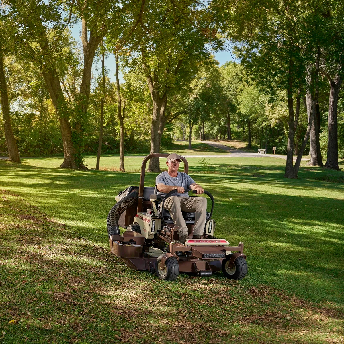 MidMount Grasshopper lawn mower collecting leaves