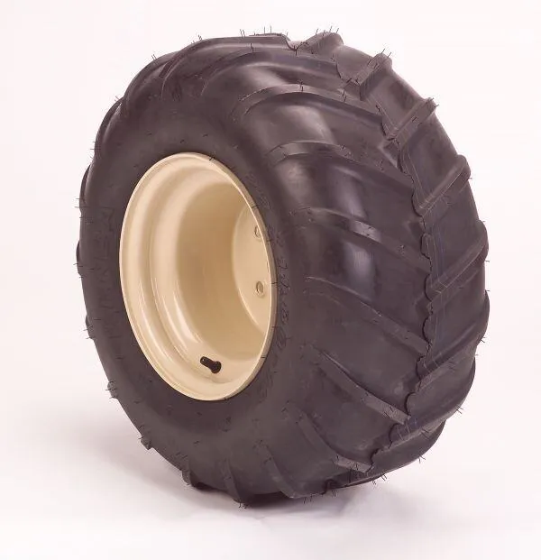 Single bar-tread mower tire mounted on a cream wheel rim against a white background.